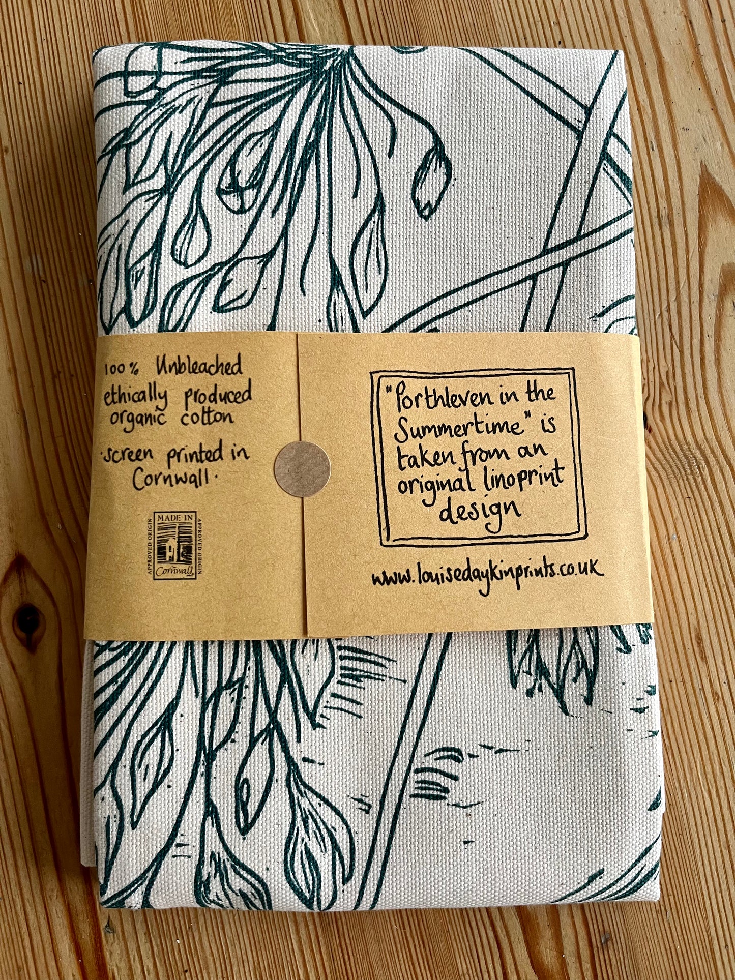 Packaged back of "Porthleven in the Summertime" tea towel