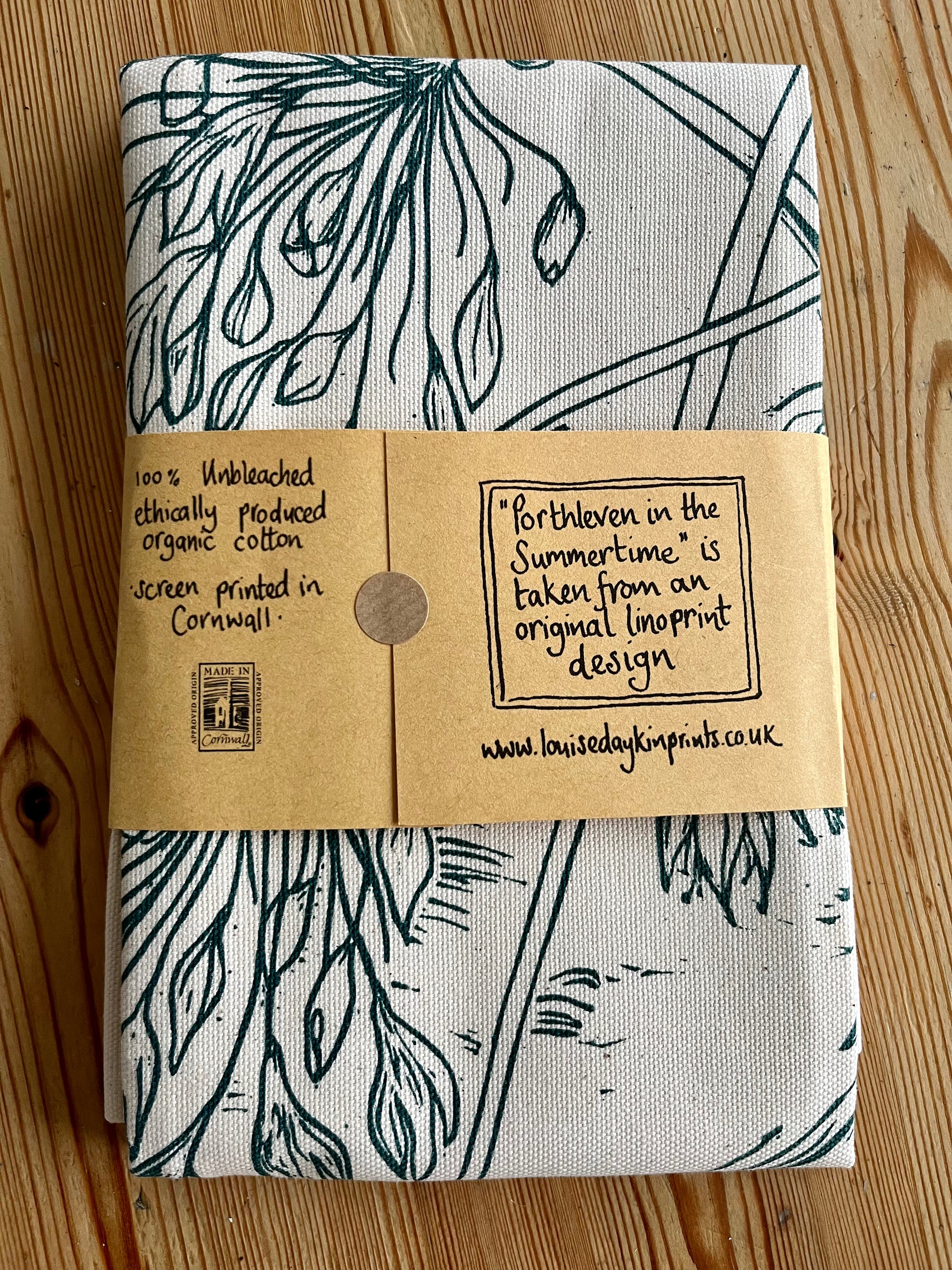 Packaged back of "Porthleven in the Summertime" tea towel
