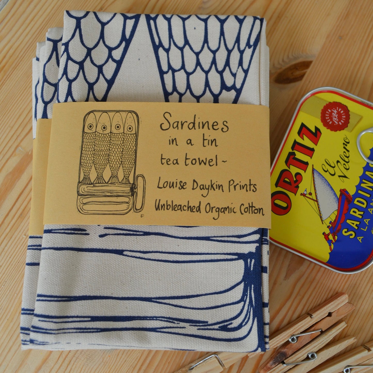 "Sardines in a tin" Tea towel comes is wrapped in an attractive brown paper band featuring a picture of the design